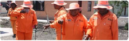 15 men in orange jumsuits